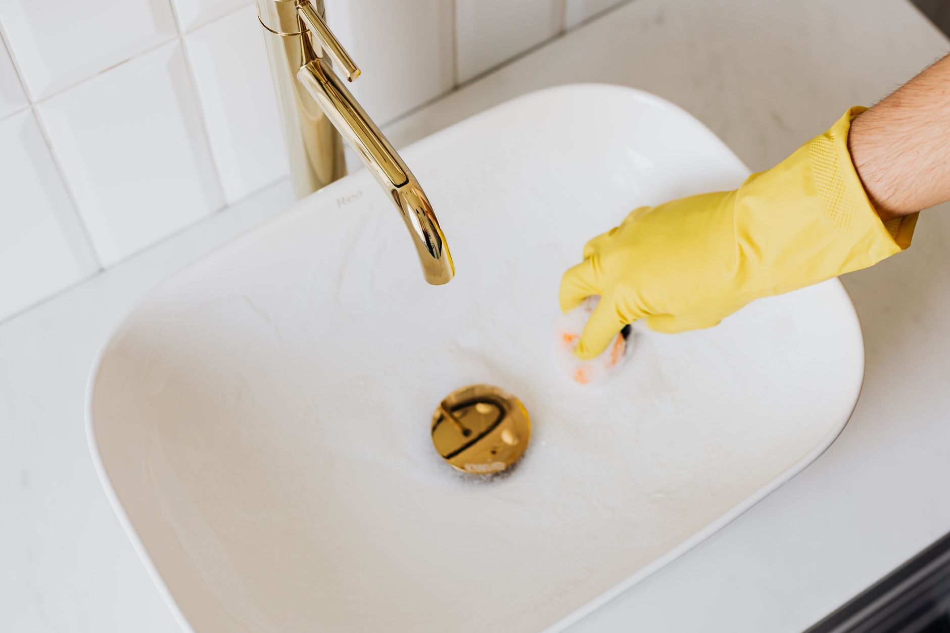 plumber clearing residential drain